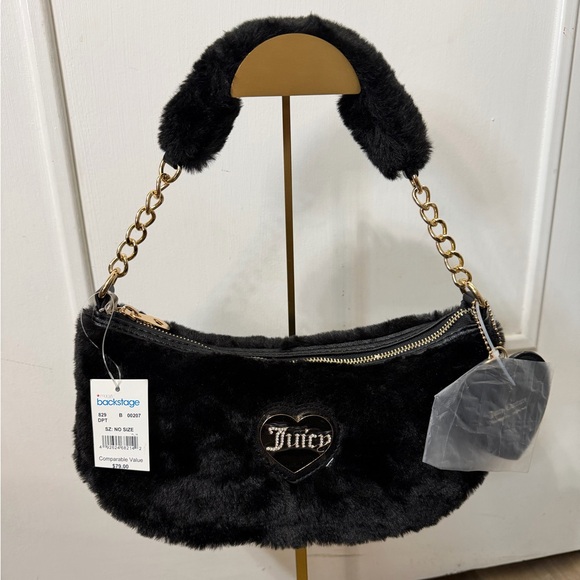 Juicy Couture Handbags - Juicy Couture black fuzzy bag. Comes with the heart and crown charm.